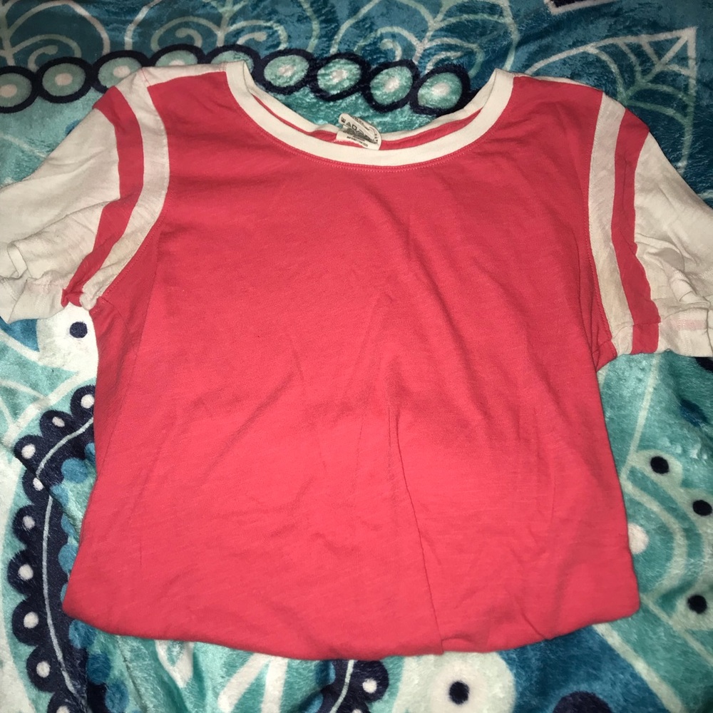 Pink and white shirt.